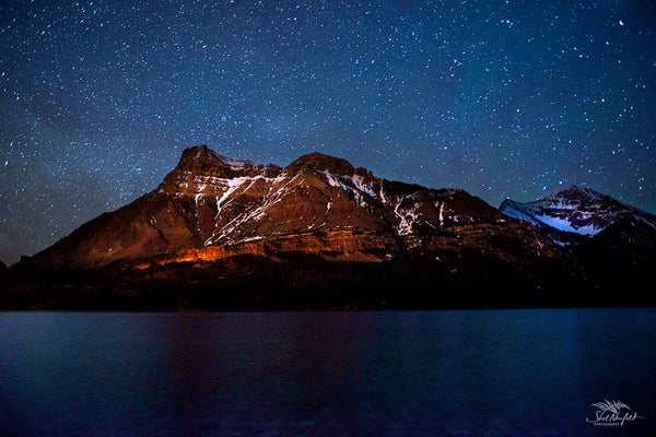 Waterton Peak Astrophotography by Shel Neufeld. Available as a canvas or print, in a variety of sizes. 