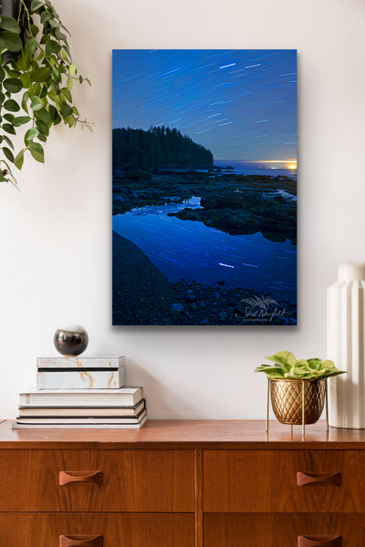 Vertical Astrophotography at Sombrio Beach Canvas hangs in a living room. Photography by Shel Neufeld, Canadian nature photographer. 