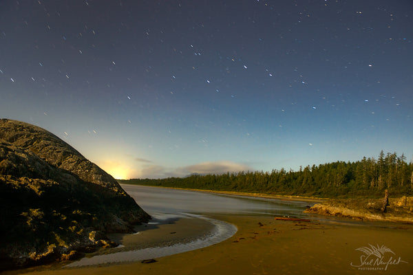 Green Point Long Beach, Tofino captured at dusk with the sun and stars sharing the sky. Photograph captured by Shel Neufeld and available in a variety of sizes and print mediums,