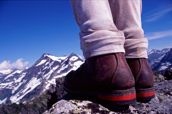 Adventure is out there - Hiking Boots and Mountain Looking Toward Mt Pitt, Garibaldi Park, BC by Shel Neufeld Photographer