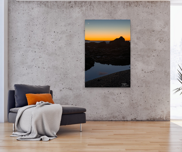 Vertical Sombrio Beach Sunset with moon canvas hangs in a living room. Artwork by Shel Neufeld from Roberts Creek, BC, Canada. 
