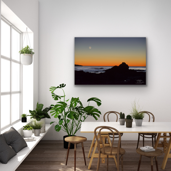 Sombrio Beach sunset canvas by Shel Neufeld, nature and wildlife photographer. The fine art photography canvas hangs in a living room scene, lifestyle image.