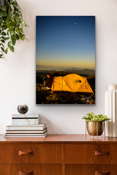 Adventure photography canvas with North Face yellow tent hangs in a living room. Artwork by Shel Neufeld. 