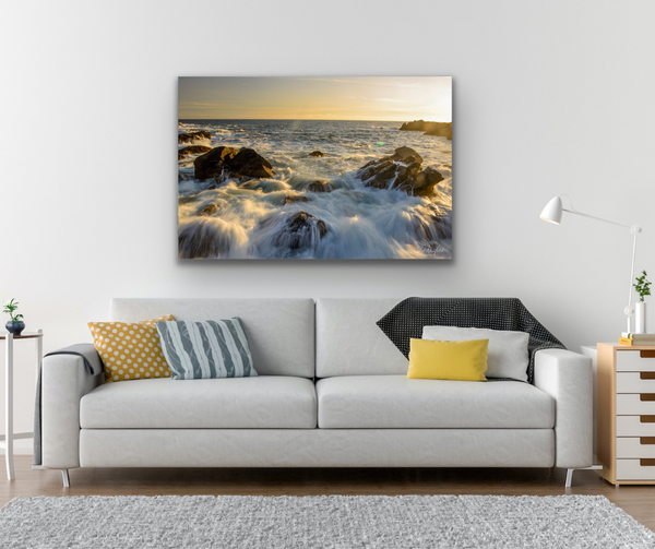 Ucluelet Water crashing fine art photography canvas hangs above a grey couch in a living room scene. The photography canvas measures 30x45 inches. It is used to help visualize what the canvas could look like in a living room decor. Photography by Shel Neufeld from Roberts Creek, BC, Canada. 