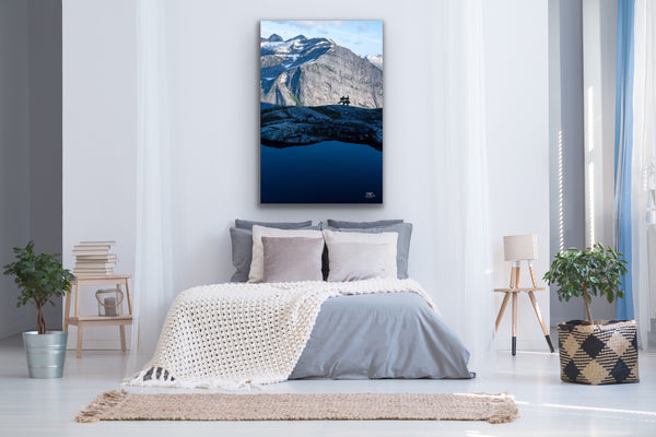 Vertical mountain landscape canvas hangs in a bedroom above the bed. Artwork by Shel Neufeld, Canadian landscape and nature photographer. 