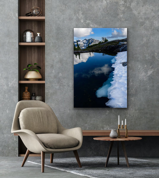 Vertical mountain glacier photography canvas hangs in a study. Artwork by Shel Neufeld, Canadian landscape and nature photographer. 